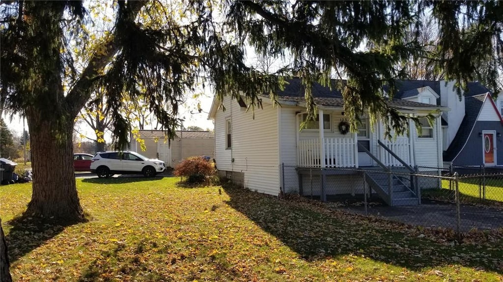 view of home's exterior with a lawn