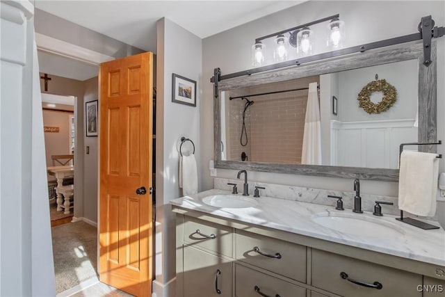 bathroom with a shower with curtain and vanity