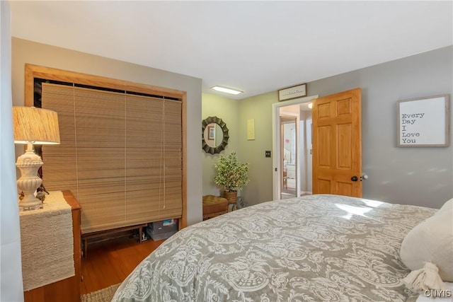 bedroom with hardwood / wood-style flooring and a closet