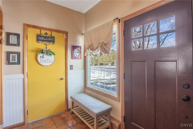 tiled foyer entrance featuring a healthy amount of sunlight