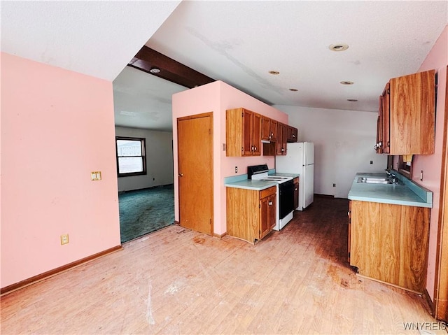 kitchen featuring light countertops, white appliances, light wood-style floors, and brown cabinets