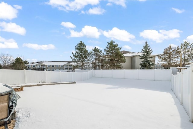 view of yard layered in snow