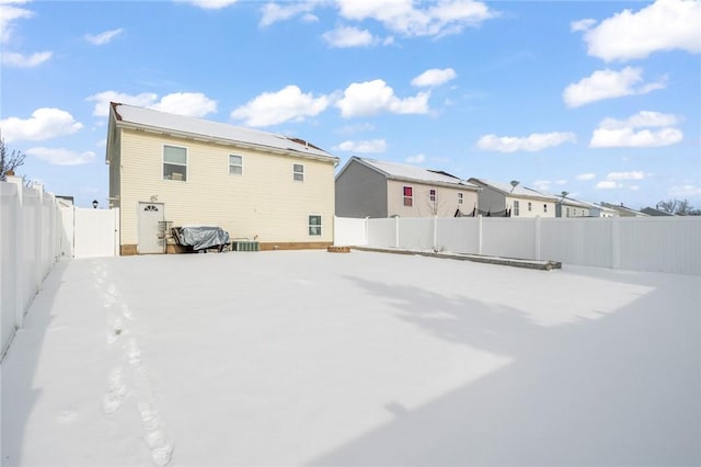 back of house with central air condition unit