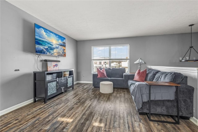 living room with dark hardwood / wood-style floors