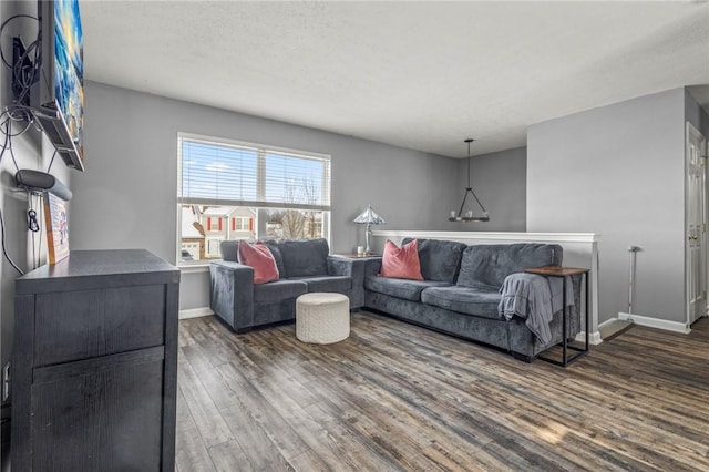 living room featuring dark wood-type flooring