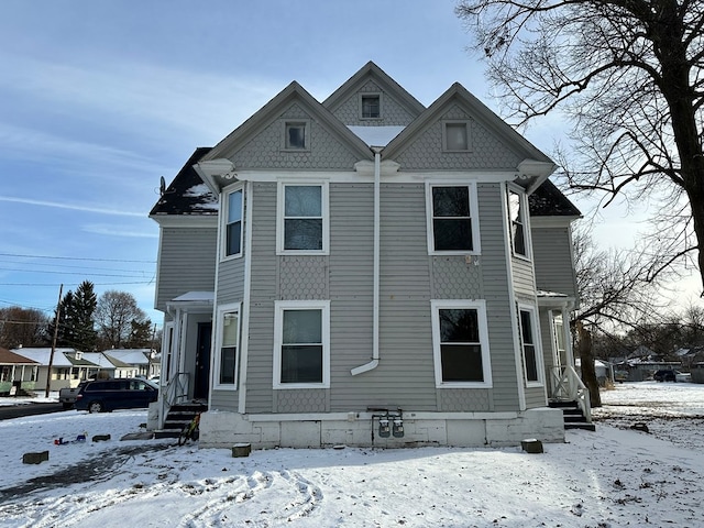 view of snow covered house