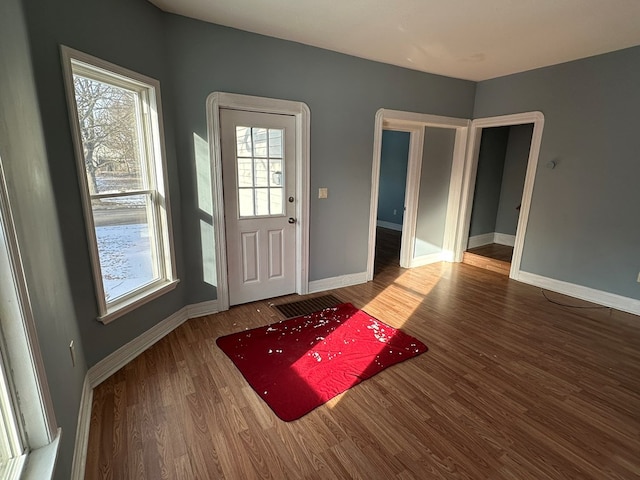 foyer with dark hardwood / wood-style floors