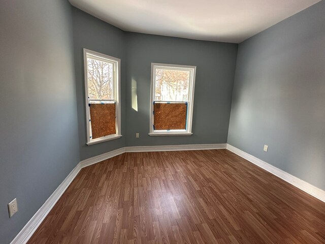 spare room with hardwood / wood-style flooring