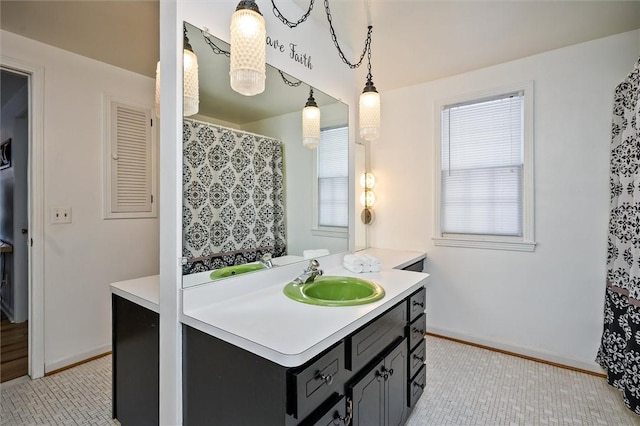 bathroom featuring tile patterned flooring and vanity