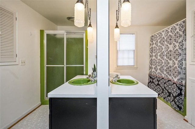 bathroom with vanity and walk in shower