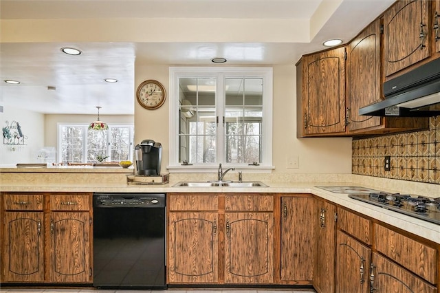 kitchen with sink, dishwasher, backsplash, gas stovetop, and decorative light fixtures