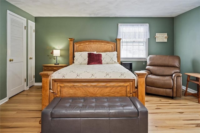 bedroom with light hardwood / wood-style floors