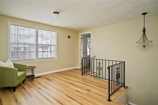 sitting room with light hardwood / wood-style flooring