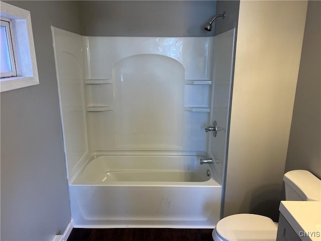 full bathroom featuring vanity, shower / bathtub combination, and toilet