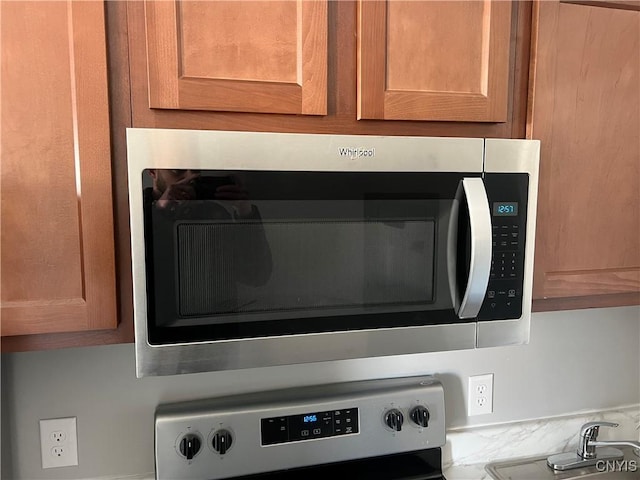 room details featuring appliances with stainless steel finishes