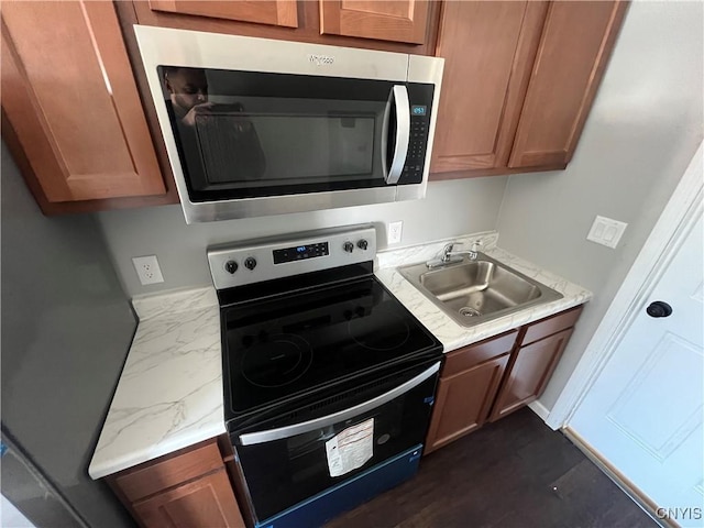 kitchen with sink and appliances with stainless steel finishes