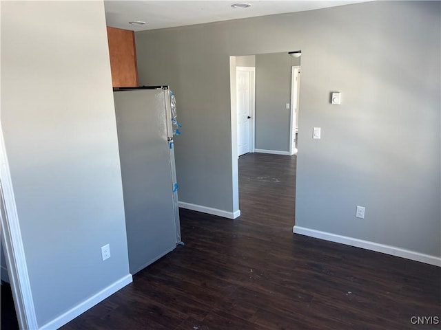 kitchen featuring dark hardwood / wood-style floors and white refrigerator