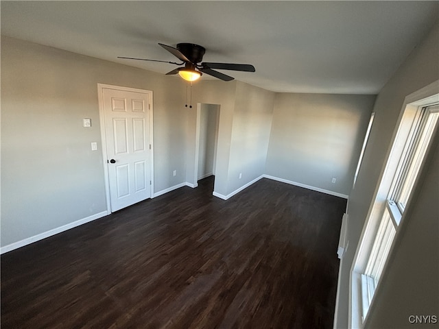 unfurnished room featuring ceiling fan and dark hardwood / wood-style floors