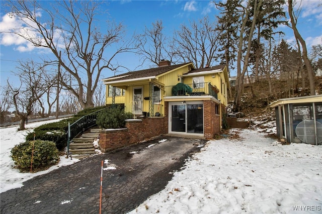 view of front of home with a balcony