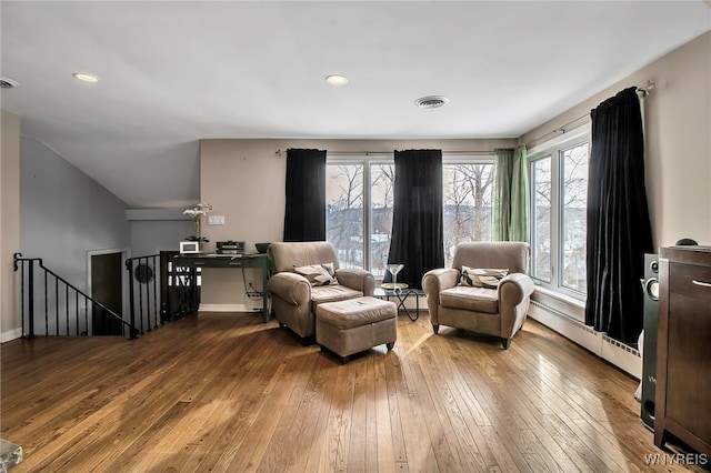 sitting room featuring hardwood / wood-style flooring and baseboard heating