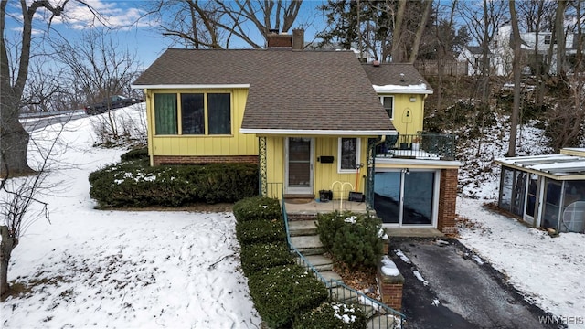 view of front of home with a balcony