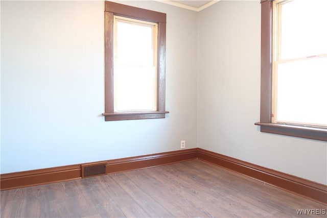 spare room with hardwood / wood-style flooring