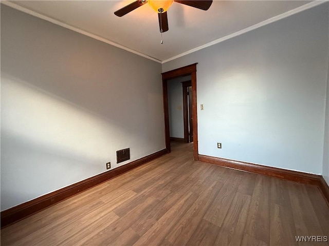 unfurnished room with crown molding, ceiling fan, and hardwood / wood-style flooring