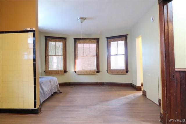 unfurnished bedroom featuring dark hardwood / wood-style floors