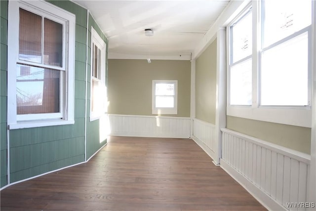 unfurnished room featuring dark hardwood / wood-style flooring and radiator