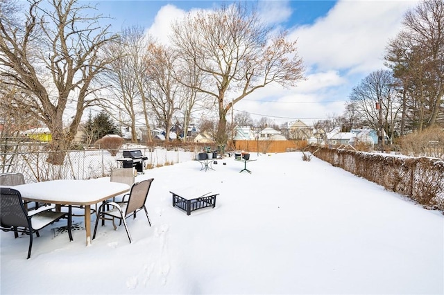 view of yard layered in snow