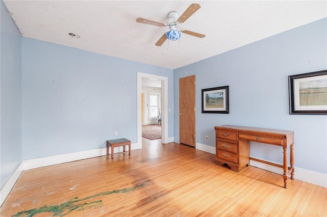 unfurnished room with ceiling fan and light hardwood / wood-style flooring