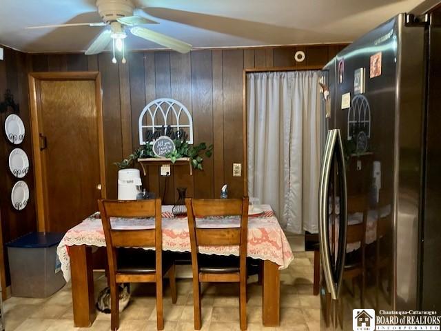 53 Burgess St, Hanover, NY 14136 - dining room featuring a ceiling fan and wood walls