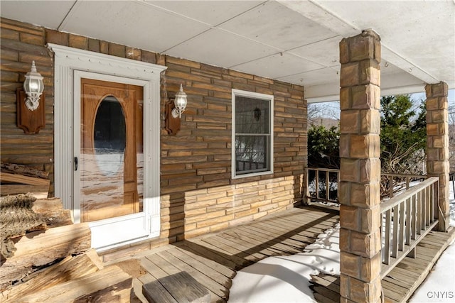 entrance to property featuring a porch