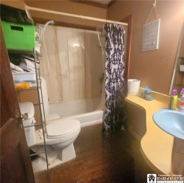 bathroom with shower / bathtub combination with curtain, toilet, and hardwood / wood-style floors