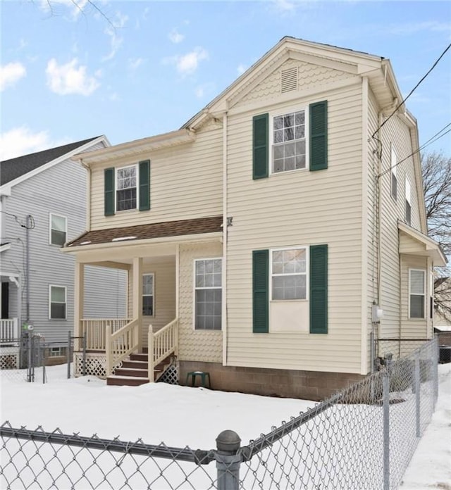 snow covered house with covered porch