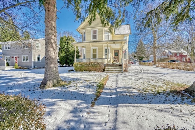 victorian house featuring covered porch