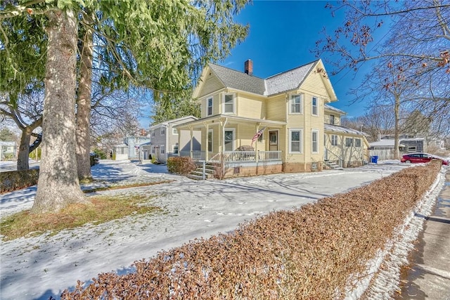 victorian-style house featuring a porch