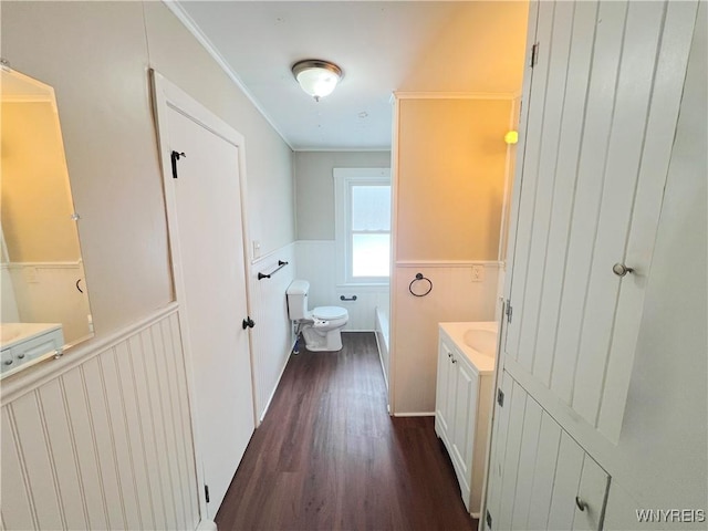 bathroom featuring ornamental molding, vanity, toilet, and hardwood / wood-style floors