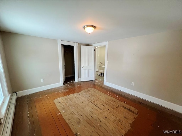 interior space featuring hardwood / wood-style flooring and baseboard heating