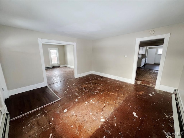 empty room with a baseboard heating unit