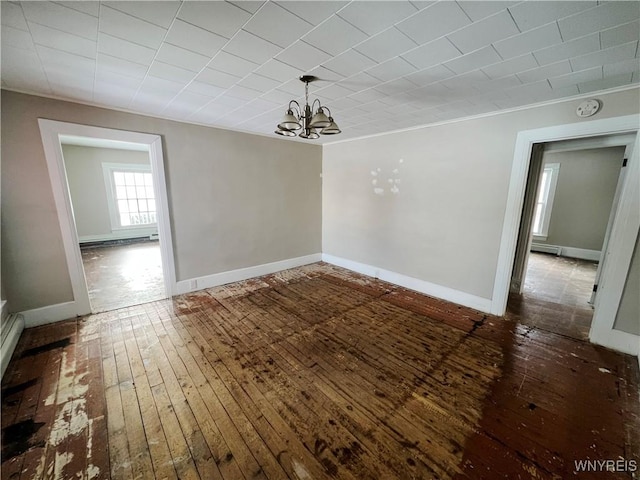 unfurnished dining area featuring dark hardwood / wood-style flooring and a notable chandelier