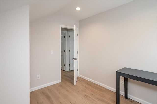 interior space featuring vaulted ceiling and light hardwood / wood-style floors