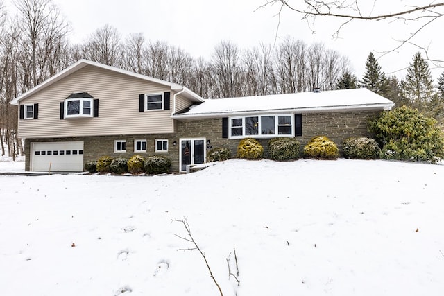 split level home featuring a garage