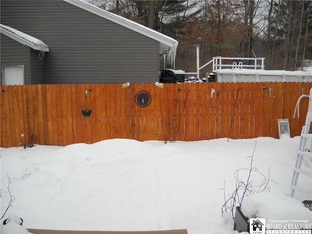 view of yard covered in snow