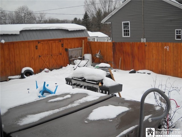 view of yard covered in snow