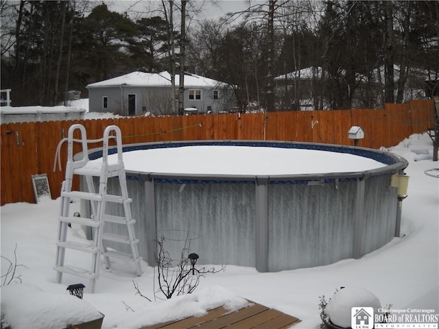 view of snow covered pool