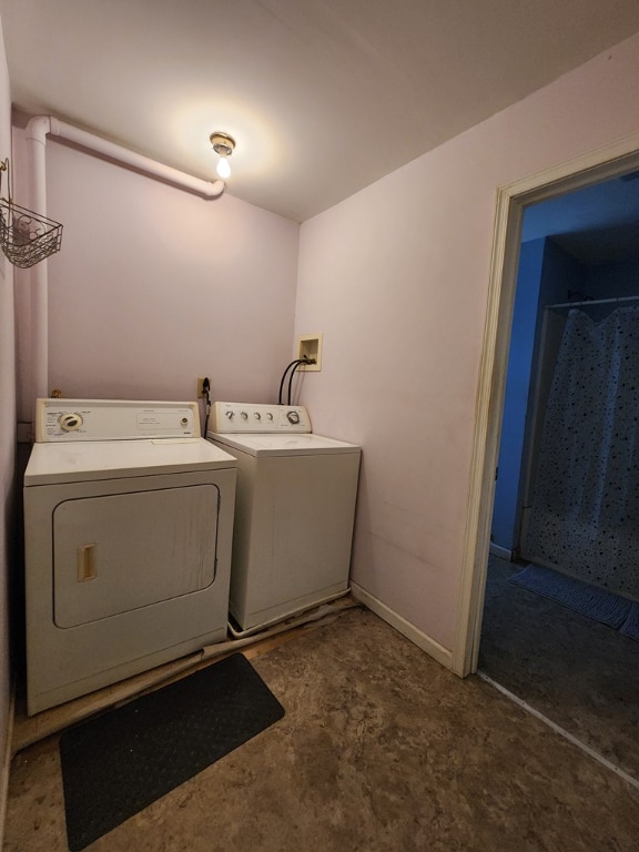 laundry area featuring washing machine and clothes dryer