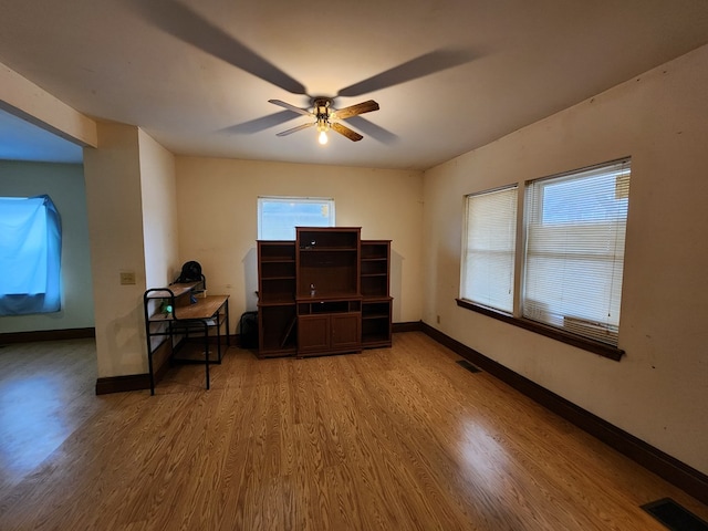 office area with ceiling fan, plenty of natural light, and hardwood / wood-style floors