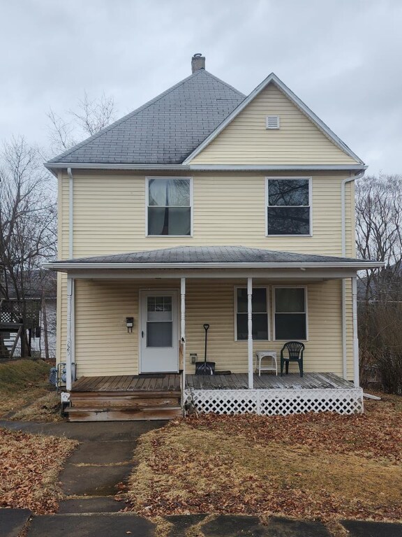 view of property featuring covered porch