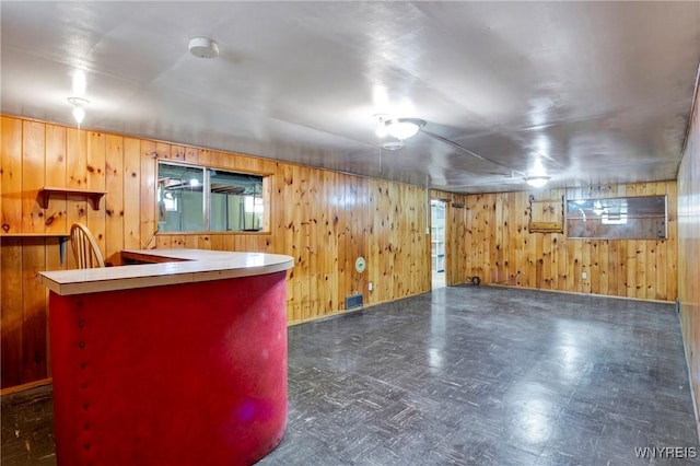 bar featuring wooden walls